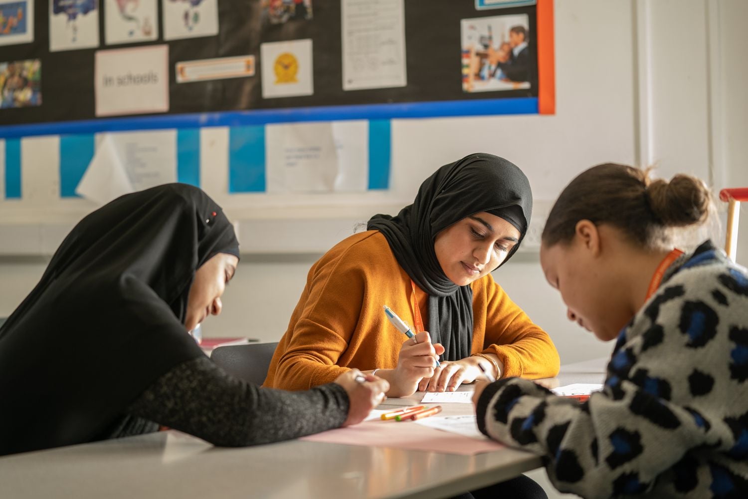 education students studying at a desk together