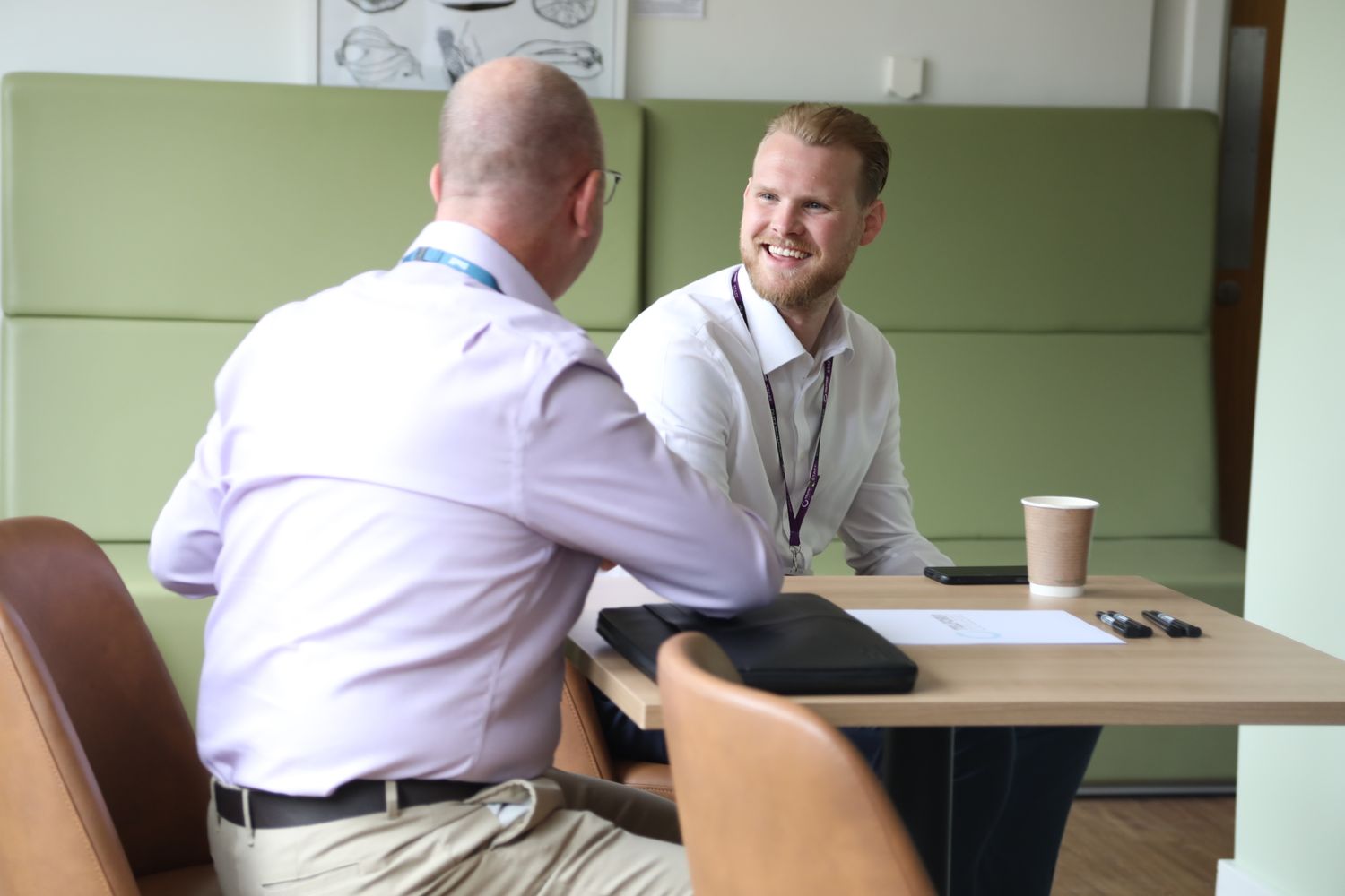 Management & HR tutor and student in meeting