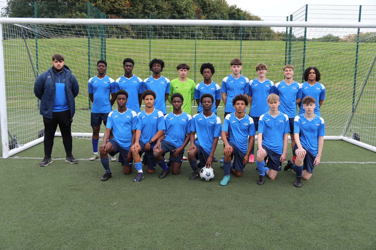 sport students playing football lined up