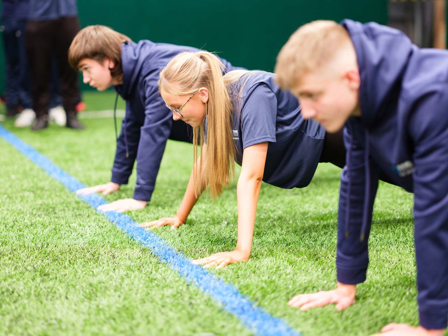 sport students playing on astroturf