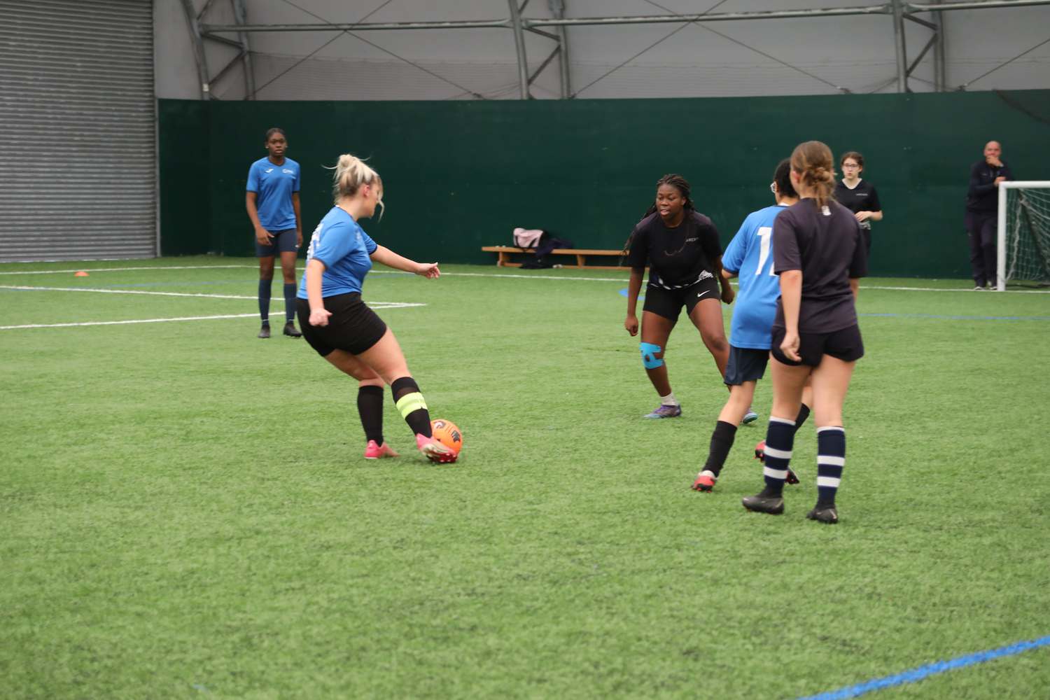 sport students playing football on field