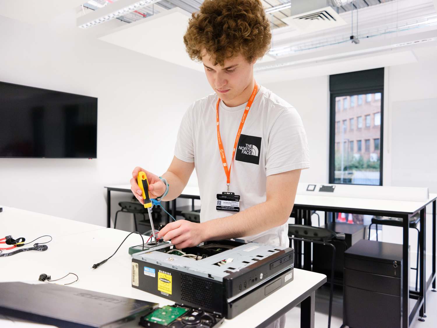 computing students fixing computer
