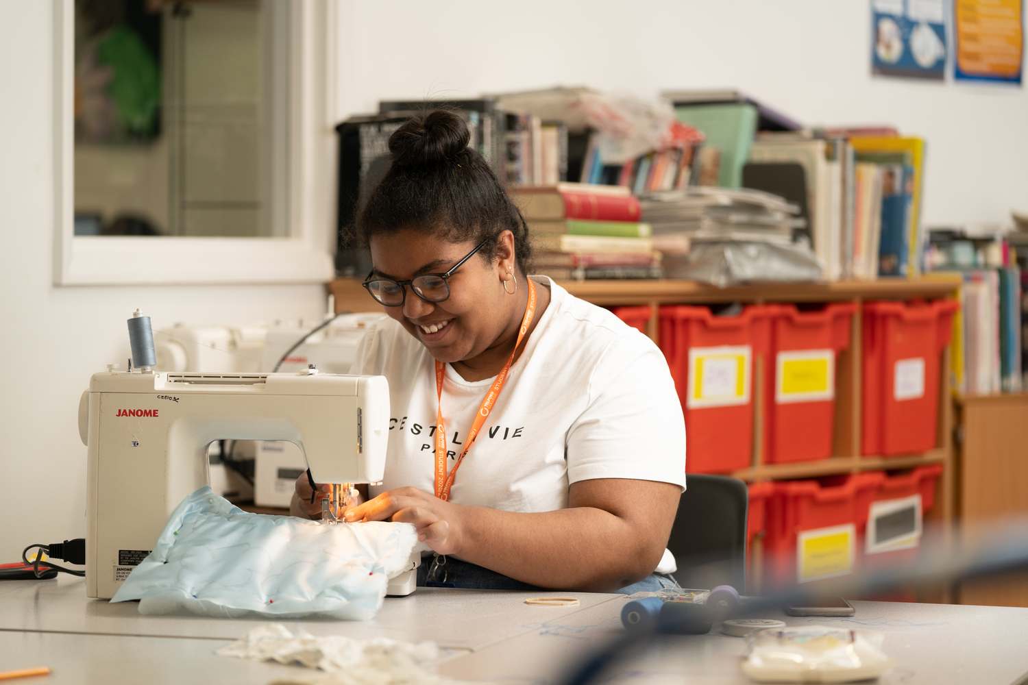 creative student at work with sewing machine