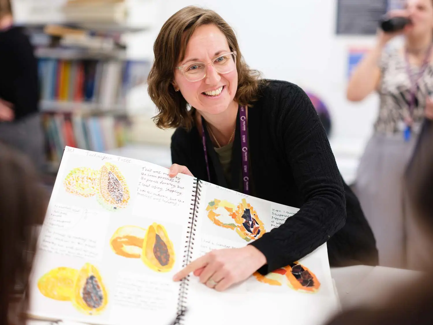 creative tutor with artwork in workshop