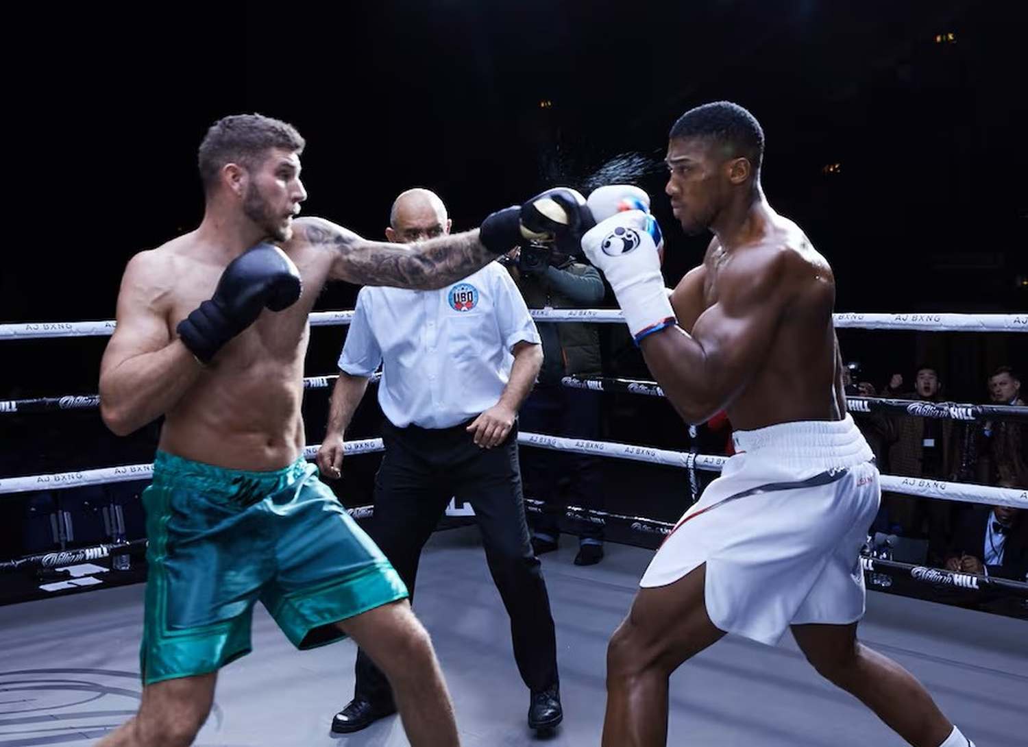 Alumni Joe Lockley in the ring with Anthony Joshua