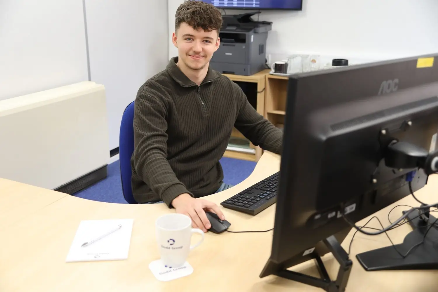 apprentice student at desk