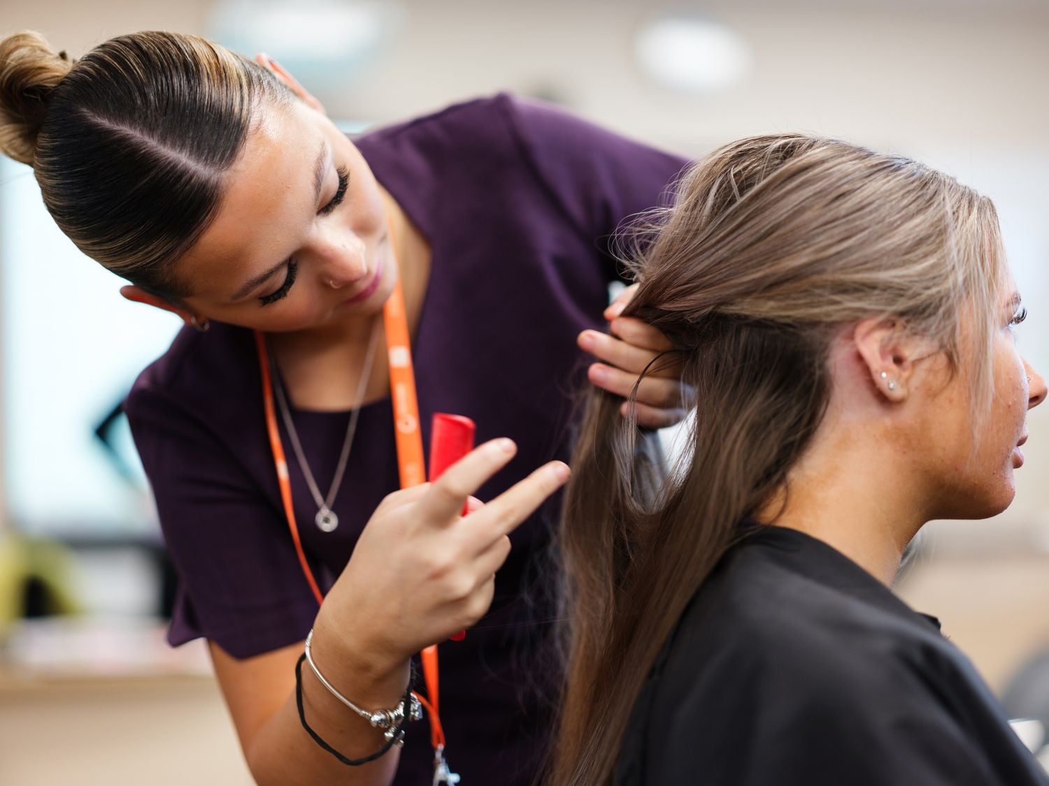 hair and beauty student in the retreat styling hair