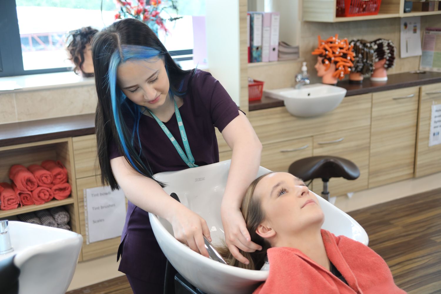 hair and beauty student in the retreat washing hair
