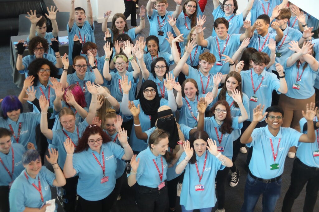 Students with their hands in the air
