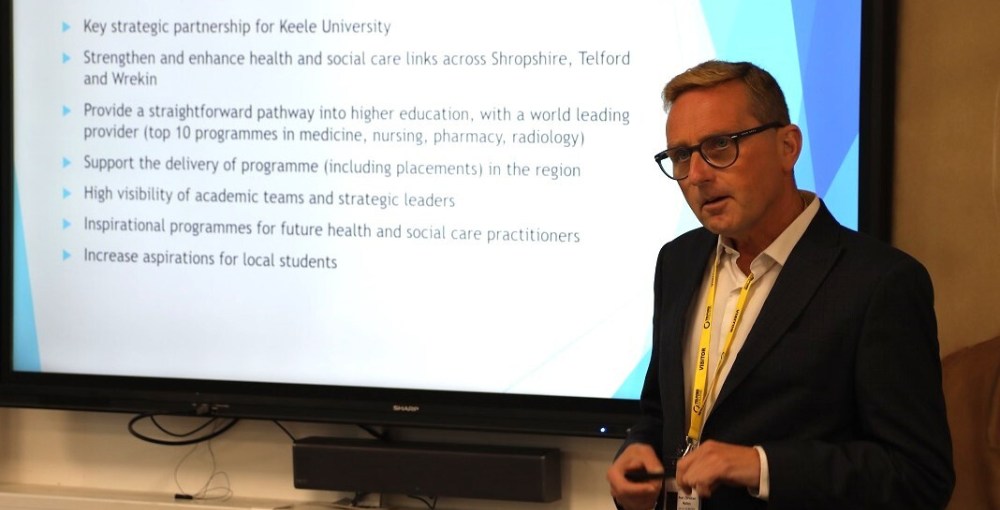 Professor Christian Mallan giving a presentation