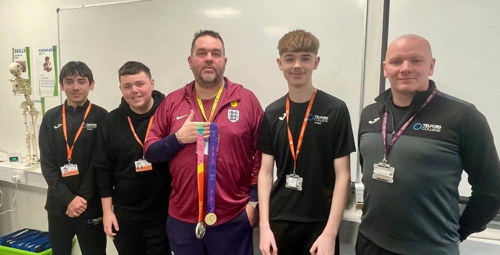 Kevin Fenner with sports students Ryan Povey, Liam Downing, Ethan Wynn and lecturer Jason Jones, who got to see his gold and silver medals from the Euros and world cup
