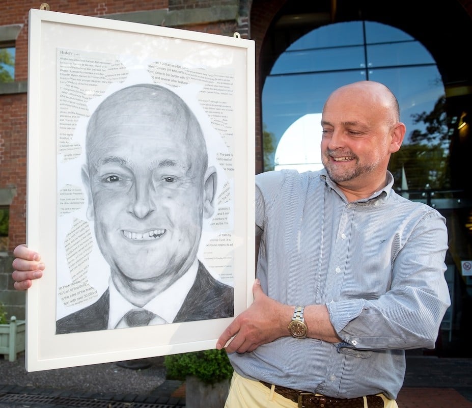 Gareth Williams with the portrait created by Rocky Trower