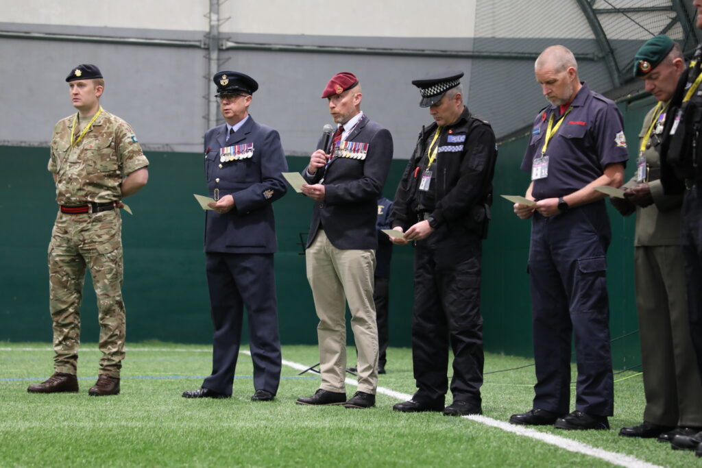 WO1 Stewart Riddle of the Queen Alexander Nursing Corps read the Kohima Epitaph