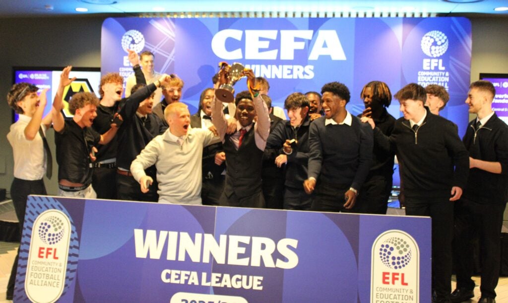 Lifting the CEFA league trophy at Wembley