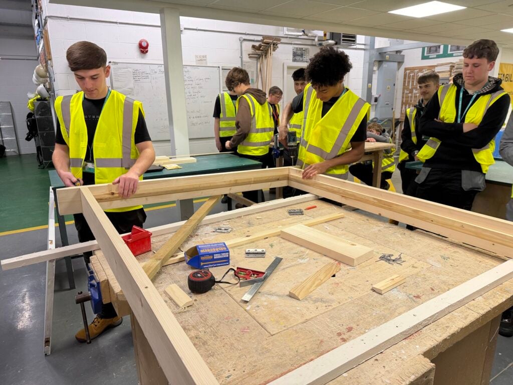 TADLOP production of Frozen - construction students at work on building sets